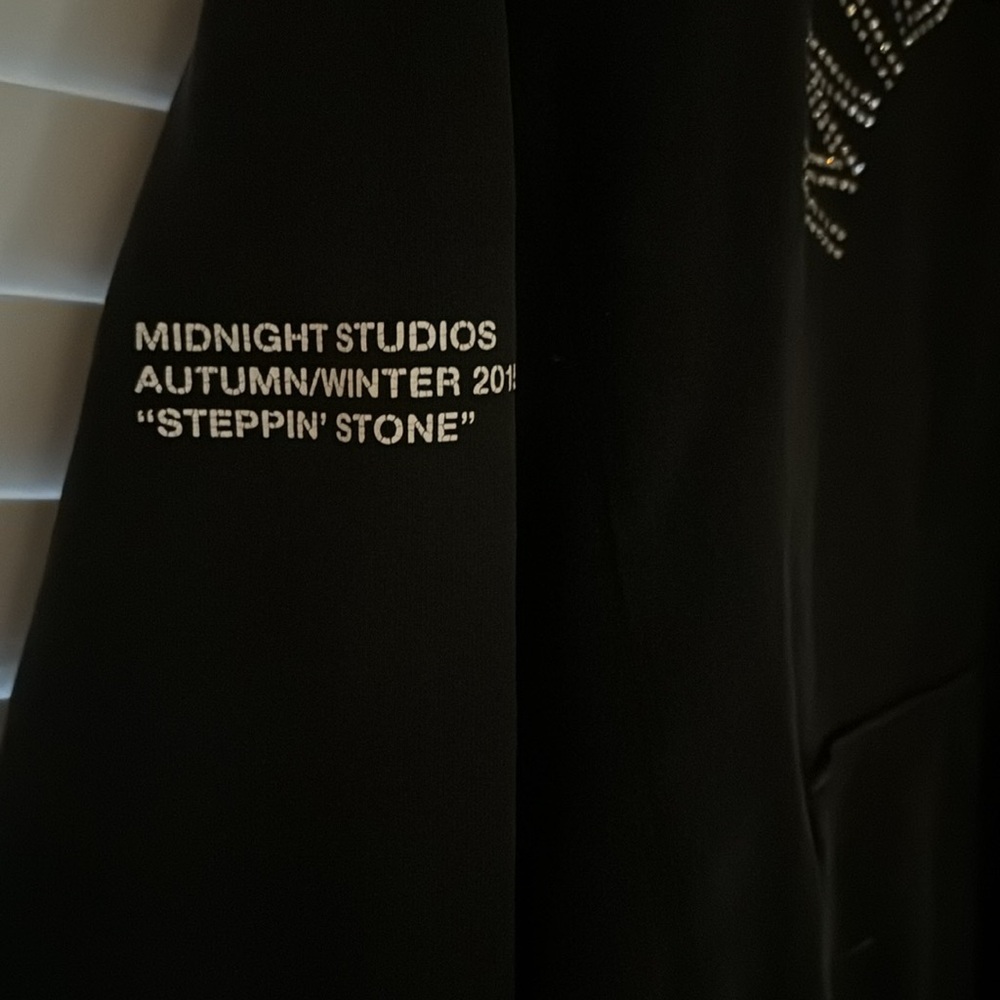 Small black Midnight Studios hoodie.